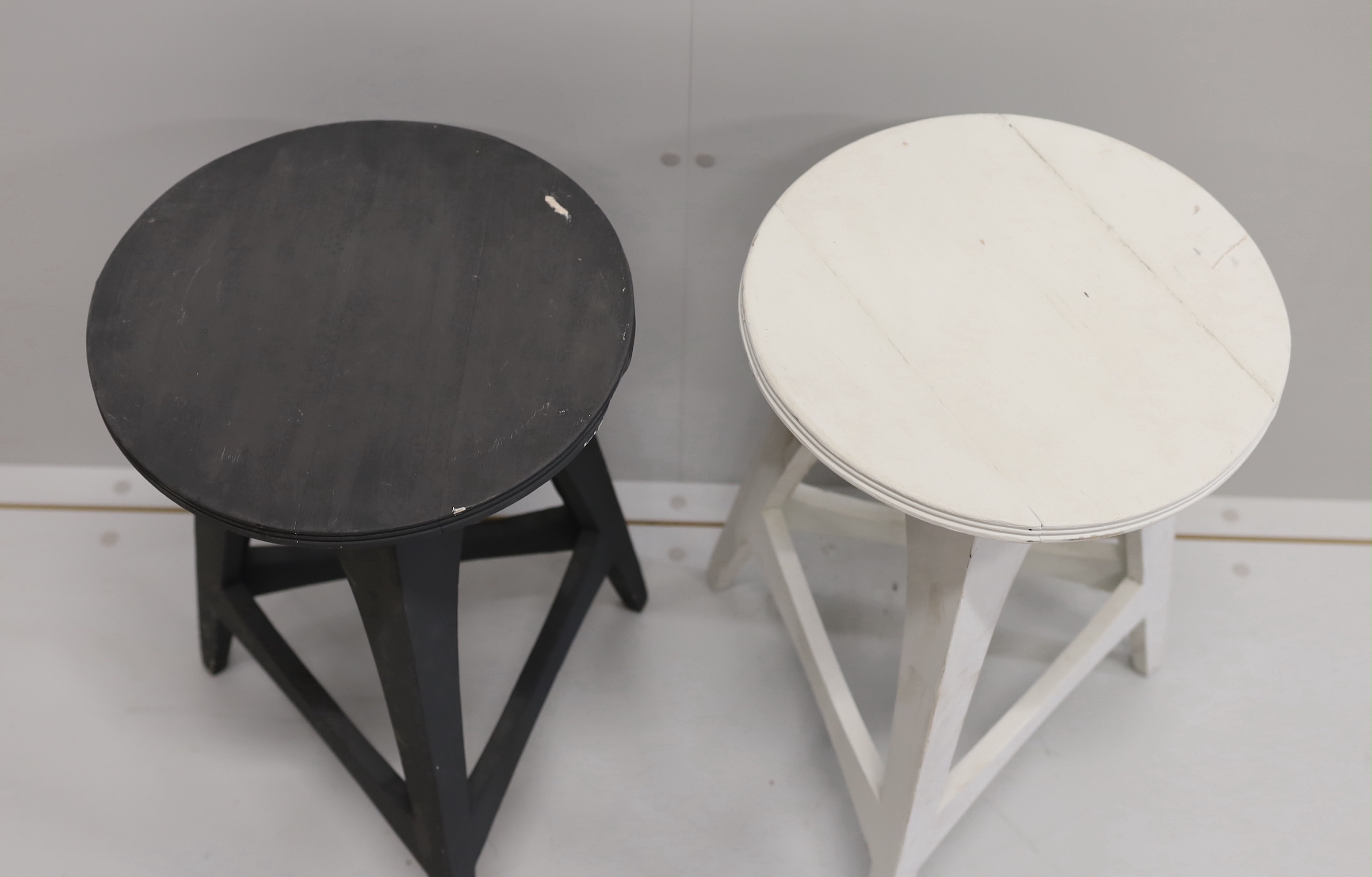 A pair of contemporary circular painted cricket tables, diameter 35cm, height 60cm